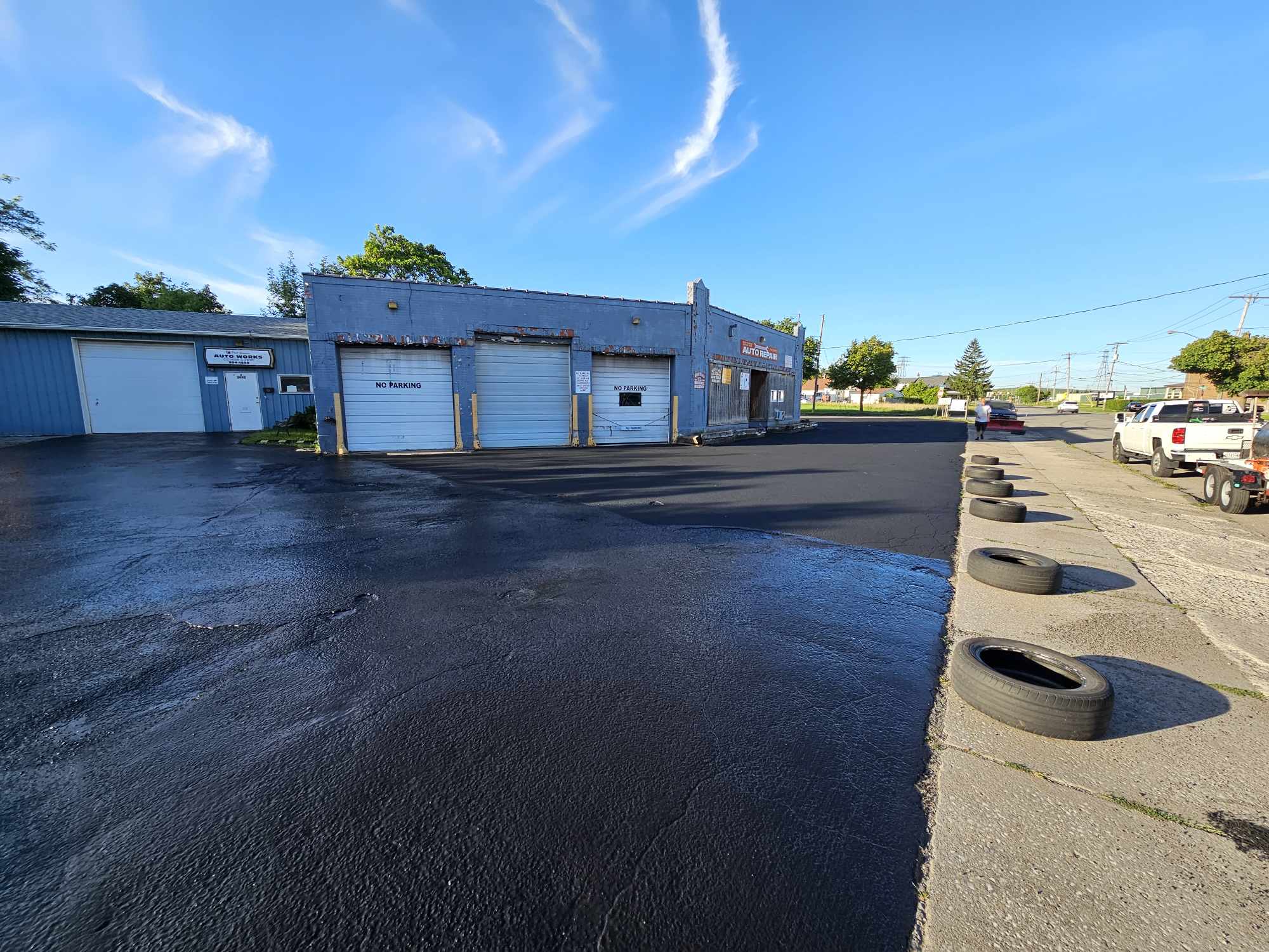 Auto shop commercial parking lot freshly sealed and striped